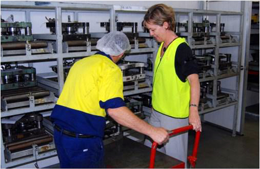 Photo of worker being given on-site health advice in the workplace